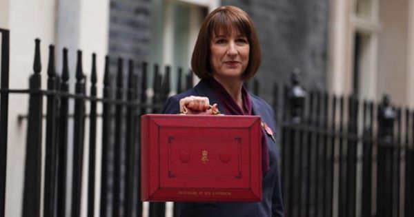 Rachel Reeves holds up red box at Downing Street before budget