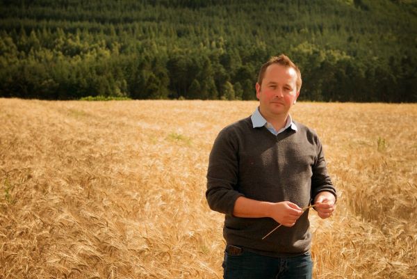Gregg Glass in a field of barley